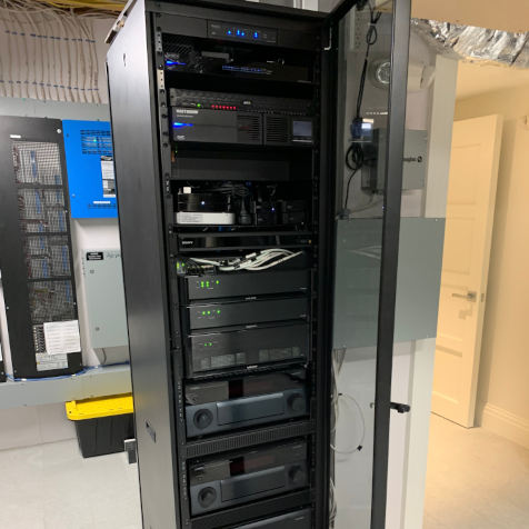 Rack containing Network,
                                Savant, Yamaha, Video Surveillance, UPS Backup